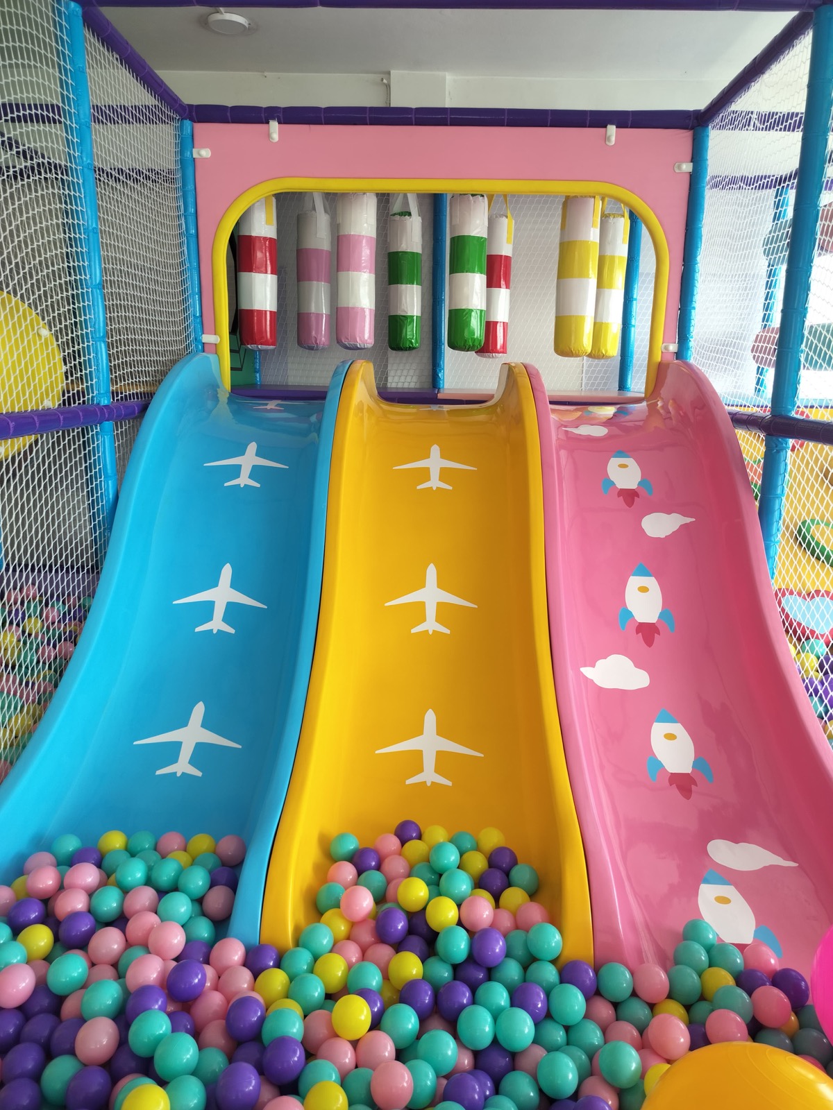 Colorful triple slides at Funzee Games OMR